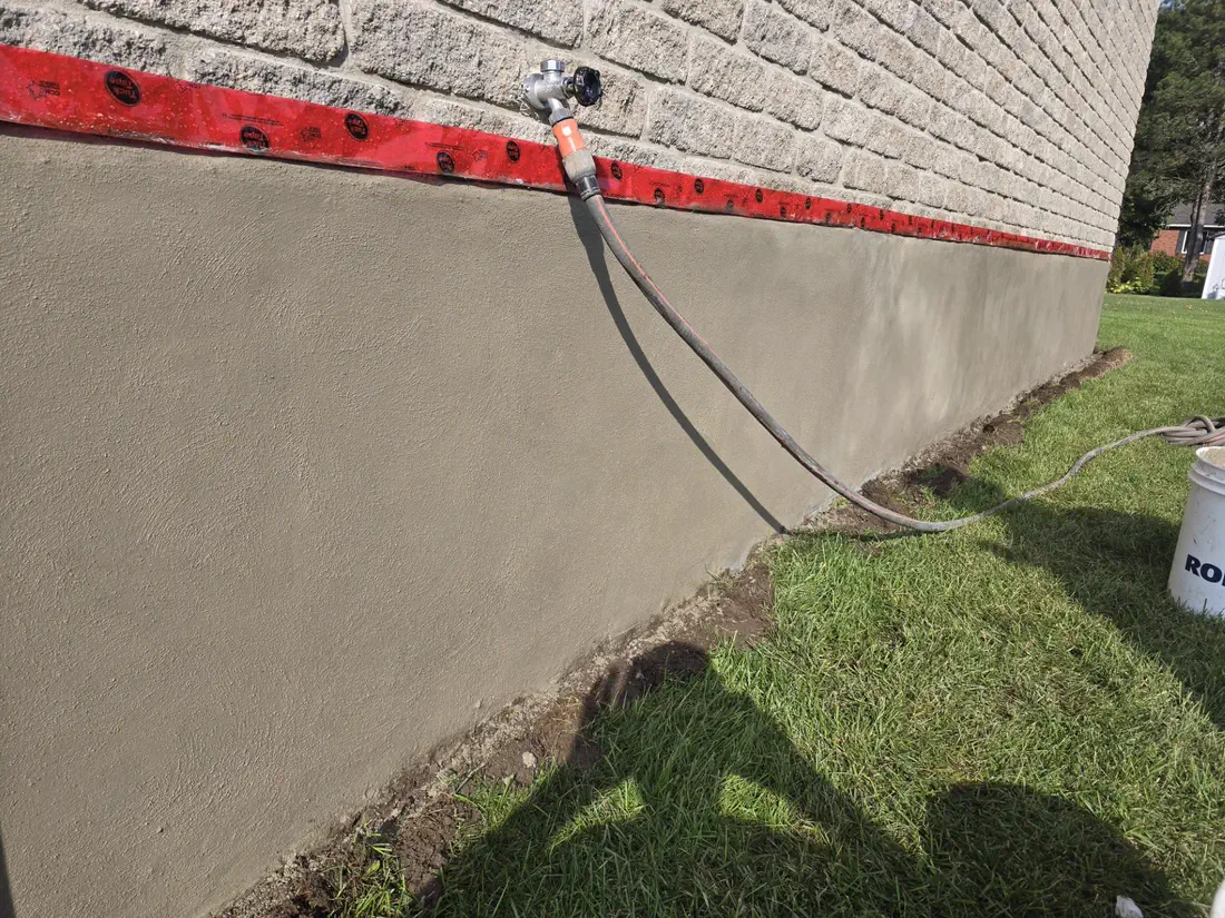 Dave and the On Point Masonry and Waterproofing crew working on a masonry repair in Paris, Ontario
